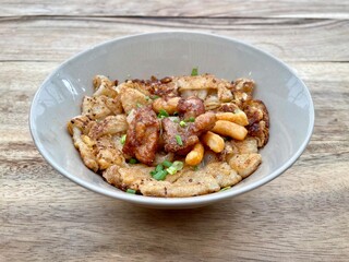 Stir fried rice noodles with Chicken (Kuaitiao khua kai) is a popular Chinese-influenced Thai dish made with stir-fried rice noodles and chicken, top view