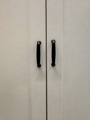 Simple white cabinet doors with black handles
