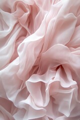 Soft, pale pink chiffon fabric in folds