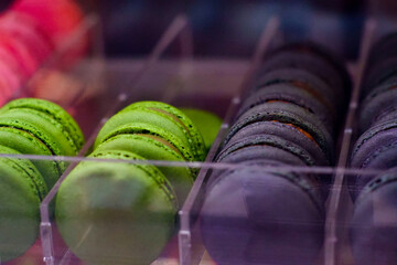 Macarons, close-up, on a shelf.