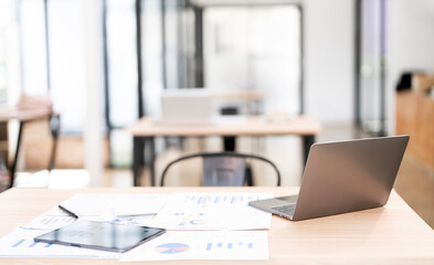 Creative workspace concept. Rear view of laptop computer on wooden table, copy space, banner background.