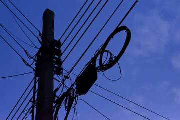Power lines and electric poles, night sky background