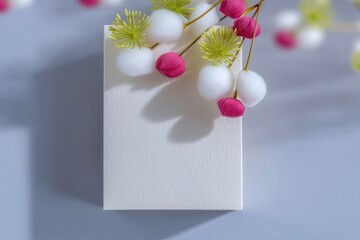 White Recycled Box with Soft Pink and White Floral Detail Flatlay