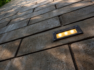 Recessed outdoor lighting in the brick wall