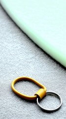 Yellow Leather Keychain on Soft Green Felt Surface
