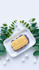 Yellow Soap Bar on White Ceramic Tray with Eucalyptus Leaves