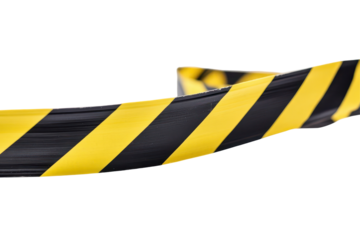 Caution tape in black and yellow stretches across an area to indicate hazards and restrict access, securing the surrounding space and ensuring safety for passersby