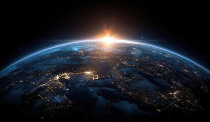 Obraz premium Stunning view of Earth from space with glowing city lights and sunrise over the horizon, showcasing blue and orange atmospheric layers against the cosmic darkness