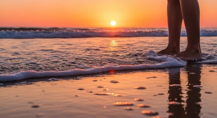 Fototapeta premium Person Standing on Beach at Sunset with Water and Waves