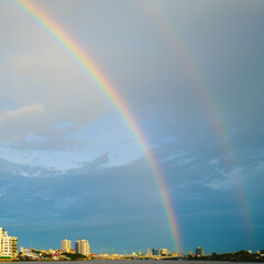 Secondary rainbows occur after rain, a seasonal change concept in the rainy season.