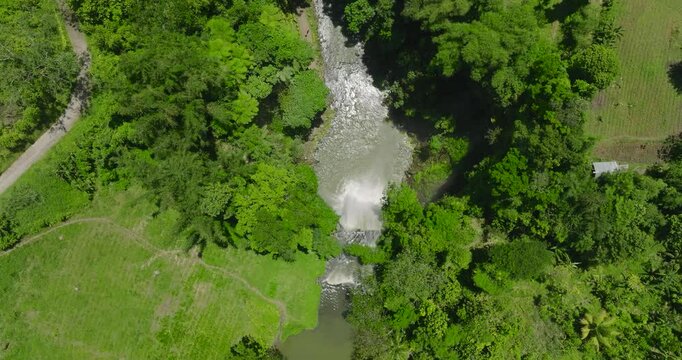Waterfall in the middle of agricultural land. Seven Falls in the rainforest. Lake Sebu. Mindanao, Philippines.