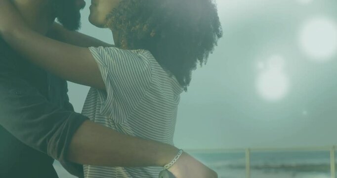 Couple gripping handlebar by railing for travel ad, sparking embrace and sharing kiss amid flares