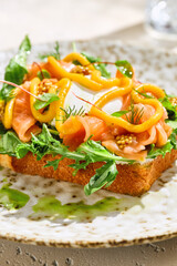 Brioche bread bruschetta with salmon and poached egg, bright lighting, closeup composition