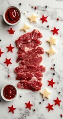 Raw sliced meat, arranged on marble, with sauces and star-shaped decorations