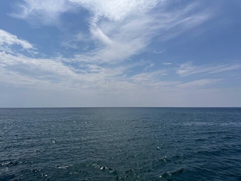 Open sea and blue sky clouds.