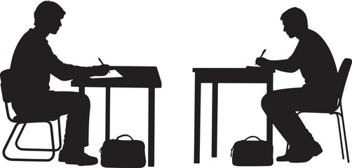 Silhouette of a person studying at a desk
