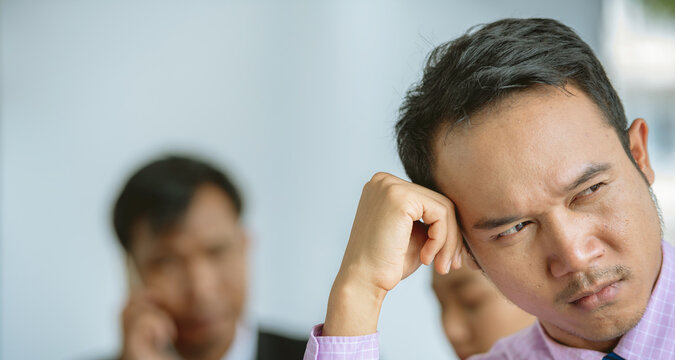 Frustrated brunette tired man talking on phone Stressed upset in troubles with bad news. cell phone feel hopelessly Upset unhappy .