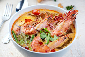 Tom Yam Kung or Tom Yum soup is Thai hot spicy soup shrimp or prawn with lemon grass, lemon,...