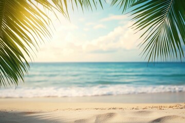 Fototapeta premium Tropical beach scene with palm fronds framing a soft focus view of ocean and sky. Sunlight filters through the leaves