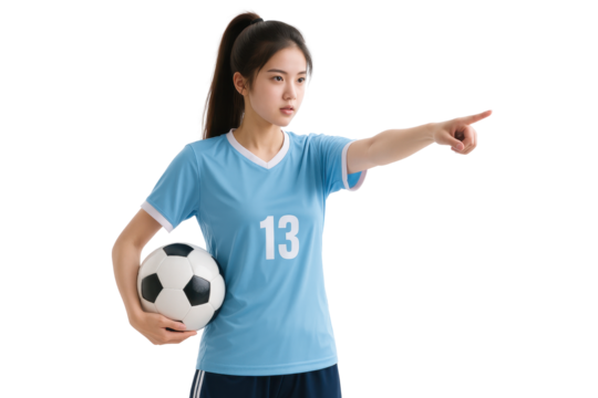 Soccer Player Pointing: A female soccer player, holding a ball and pointing, epitomizes focus and determination on the field, ready for action.