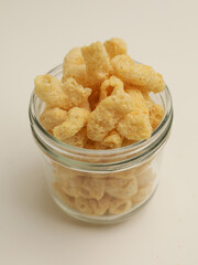 Crunchy snacks or chips on white background