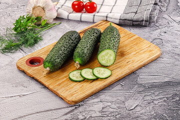 Raw green cucumbers with slices