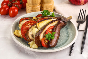 Baked tomato with mozzarella and tomato