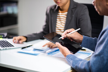 Professionals discussing financial report and documents during office meeting. Accounting, tax review