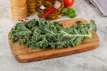 Green Kale cabbage leaves ocer board