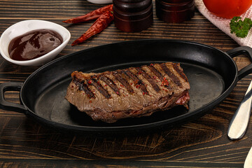Grilled beef striploin steak with sauce