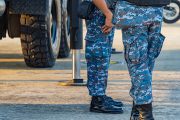 Soldiers in military uniforms wear military combat boots.