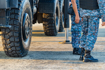 Soldiers in military uniforms wear military combat boots.
