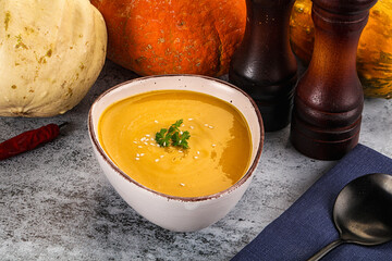 Vegan pumpkin cream soup served sesam