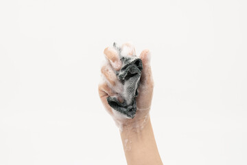Hand Holding Soapy Dish Sponge for Cleaning on White Background