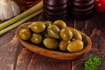 Greek green olives marinated in the bowl
