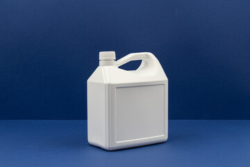 White Plastic Detergent Bottle with Handle on Blue Background