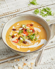 Lemongrass coconut lentil soup with red chili in a bowl