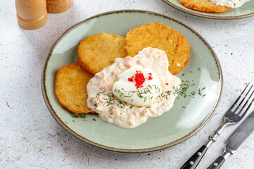 potato pancakes with sauce and herbs