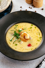 creamy soup with shrimps and herbs