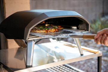Veggie Pizza Pulled from Outdoor Gas Pizza Oven