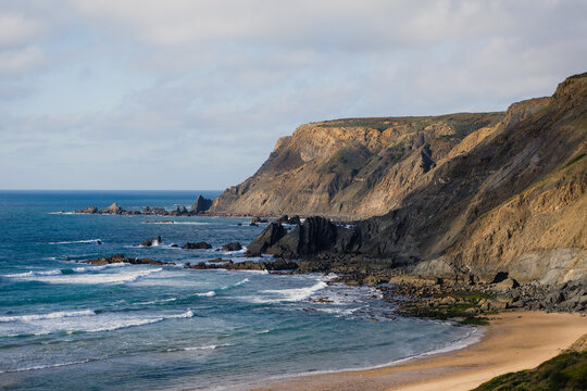 Stunning coastline inspiring surfing in praia da ponta ruiva, al