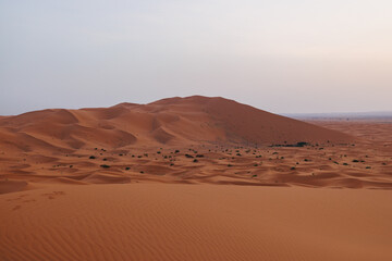 Sunrise panoramic landscape views of Erg Chebbi sand dunes located in Morocco on the western edge of the Sahara Desert