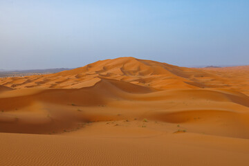 Sunrise panoramic landscape views of Erg Chebbi sand dunes located in Morocco on the western edge of the Sahara Desert