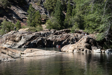 Sunlit rocky outcrop along a quiet forest stream near Lake Tahoe, July 30, 2020