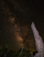 Milky Way behind jagged Mono Lake tufa under brilliant night sky