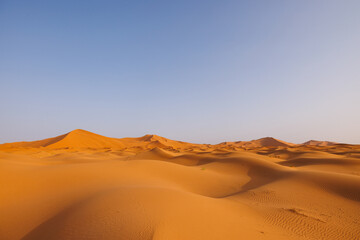 Sunrise panoramic landscape views of Erg Chebbi sand dunes located in Morocco on the western edge of the Sahara Desert