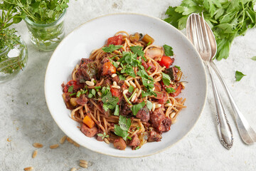 Mediterranean vegetable bolognese on a white plate