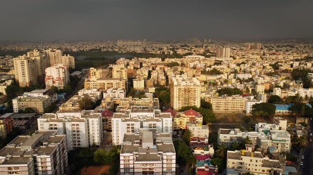 Aerial shot of BTM lake and city skyscrappers in background in Bangalore, Karnataka, India	