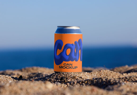 Empty Can Resting on Sandy Beach Near Ocean. PSD mockup template ready for your logo design