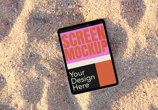 Blank tablet Resting on Sandy Beach Surface. PSD screen mockup
